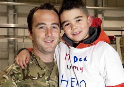 Taylor Corrin with his father Corporal Corrin. Picture: MoD