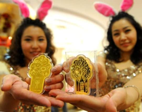 Gold is traditionally seen by investors as a safe haven during economic downturns and volatility in financial markets. Picture: AFP/Getty