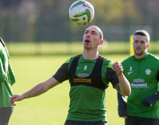 Scott Brown keeps his eyes on the ball as Celtic train ahead of the Scottish Premiership clash with Ross County. Picture: SNS
