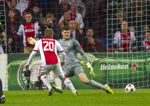Beaten but unbowed: Celtics Fraser Forster couldnt stop Ajaxs Lasse Schone scoring but is in line for a first cap this week. Picture: SNS