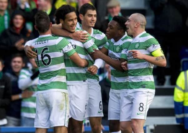 Virgil van Dijk, 2nd left, is hailed by his team-mates after scoring Celtic's first. Picture: SNS