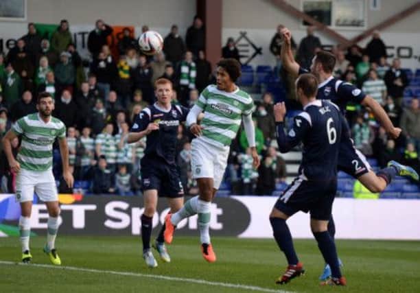 Virgil van Dijk heads home his first goal for Celtic to break the deadlock against Ross County in Dingwall. Picture: SNS