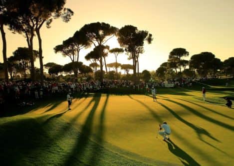 Eagle-eyed: Leader Victor Dubuisson, foreground, lines up an eagle putt on the par 5, 18th green. Picture: Getty