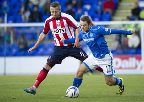 St Johnstone's goal hero Stevie May tussles with Sammy Clingan of Kilmarnock. Picture: SNS