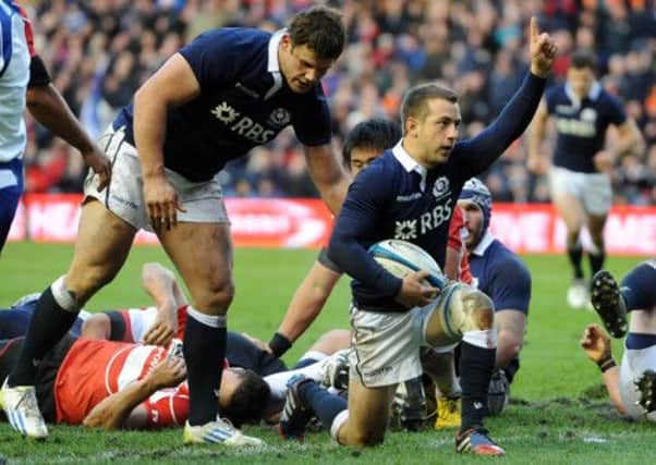 Greg Laidlaw celebrates after scoring Scotland's second try. Picture: Ian Rutherford