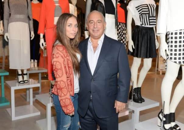 Sir Philip Green, with his daughter at a store opening in Los Angeles this year, has been growing his empire. Picture: Getty