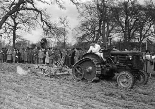 The machinery has changed since this 1948 demonstration, but a belief in hard work carries down the generations. Picture: Topical Press Agency/Getty Images