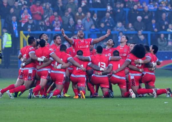 Tonga perform their Sipi Tau before kick-off against Italy at The Shay in Halifax yesterday. Picture: PA Wire
