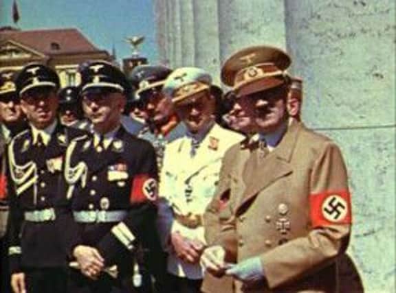 Adolf Hitler and Nazi officials in Munich in the summer of 1939. Picture: AP