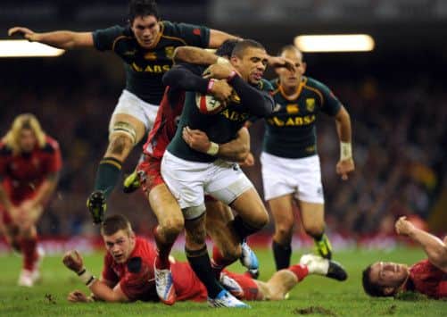 South Africa wing Bryan Habana is tackled by Wales Mike Phillips. Picture: Getty