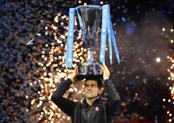 Novak Djokovic raises the trophy after defeating Rafael Nadal in the ATP World Tour Finals. Picture: Reuters