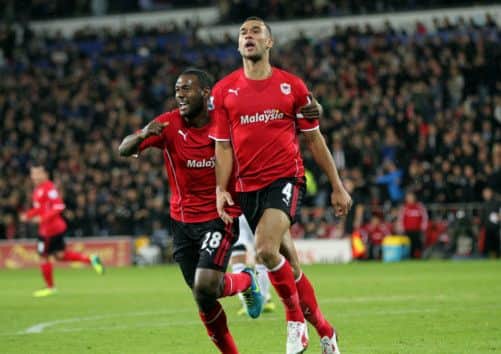 Cardiff City's Steven Caulker (R) celebrates a goal against Swansea City. Picture: PA
