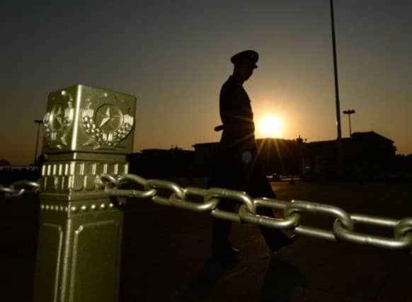 A guard in Tianamen Square, where the plenum was held. Picture: Mark Ralston/Getty