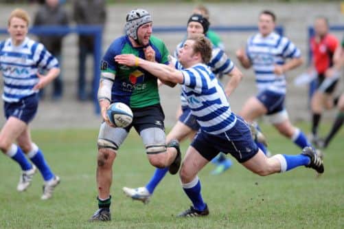Boroughmuirs Zimbabweborn flanker Andy Rose, left, in action against Heriots. Picture: Kate Chandler