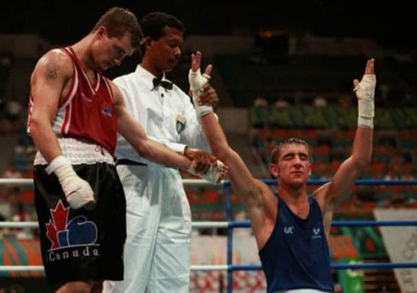 Alex Arthur sinks to his knees after winning gold in Malaysia. Picture: AP