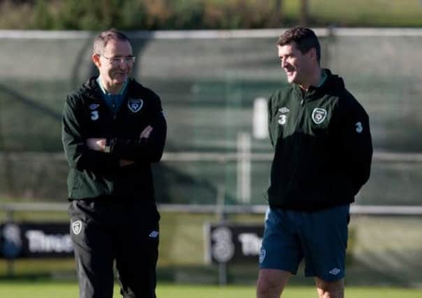 New Ireland manager Martin ONeill and his assistant Roy Keane chat during a training session yesterday. Picture: Andrew Paton/Getty