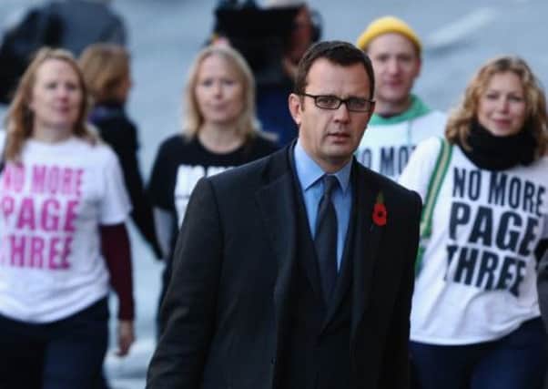 Andy Coulson came face to face with women protesting against topless women in The Sun when he arrived at the Old Bailey. Picture: Getty