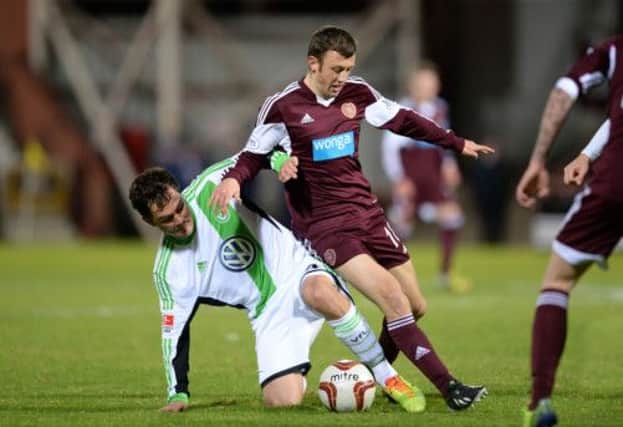 Marcel Schafer (left) tackles Hearts ace Dale Carrick. Picture: SNS