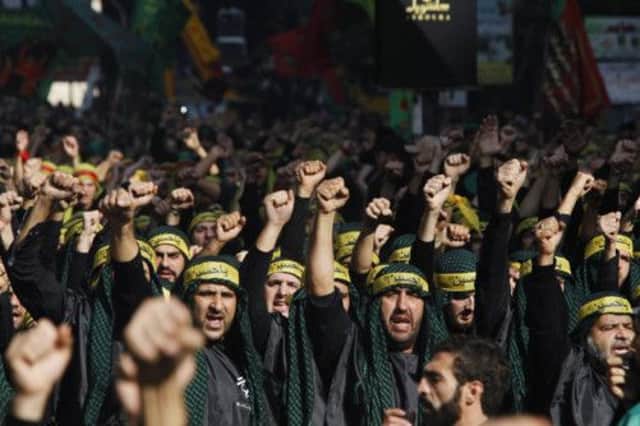 Lebanese Hezbollah supporters gesture as they march during a religious procession to mark Ashura in Beirut. Picture: Reuters