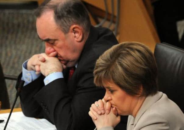 A pensive Alex Salmond and his deputy, Nicola Sturgeon, at Holyrood. Picture: Ian Rutherford