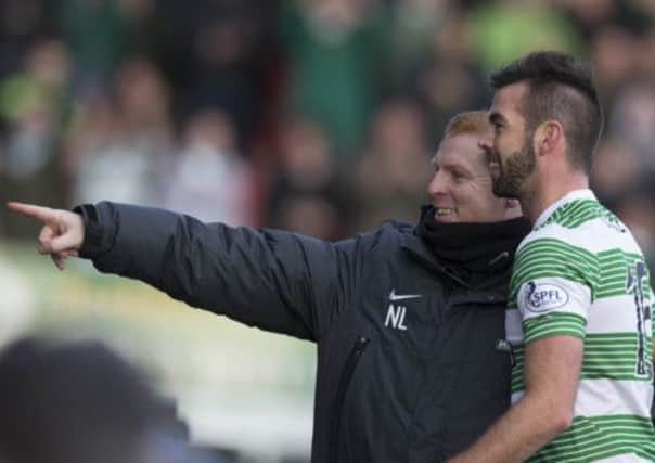 Joe Ledley shares a joke with Neil Lennon during Celtic's 4-1 win at Ross County. Picture: PA