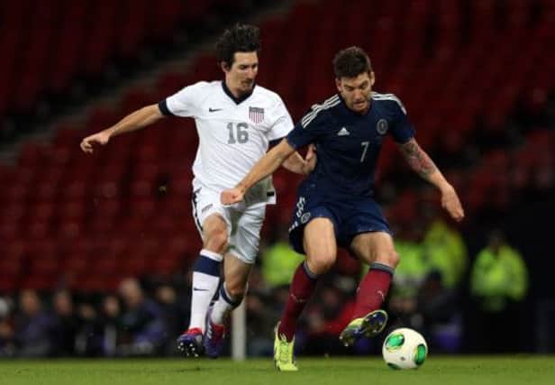 Sacha Kljestan, left, chases Charlie Mulgrew as Scotland took on the USA at Hampden. Picture: Getty