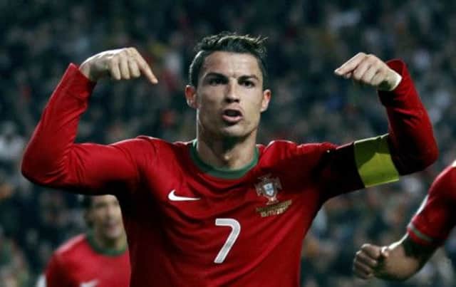 Cristiano Ronaldo celebrates after scoring Portugals late winner against Sweden in Lisbon. Picture: Reuters