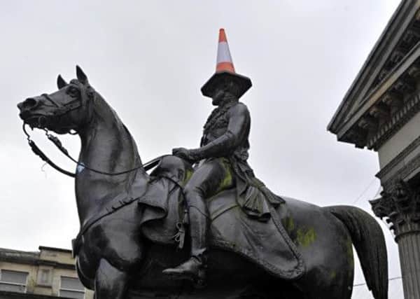 Glasgow councillors wanted to spend £65,000 on a plinth for the Duke of Wellington monument, which is often adorned by a traffic cone. Picture: Getty