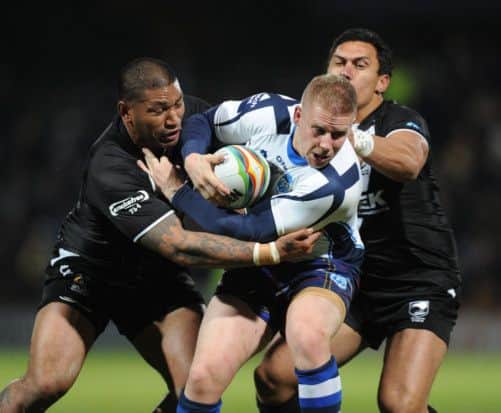 Scotland's try scorer Alex Hurst is put in his place by New Zealand's Frank-Paul Nu'uausala and Jesse Bromwich. Picture: PA