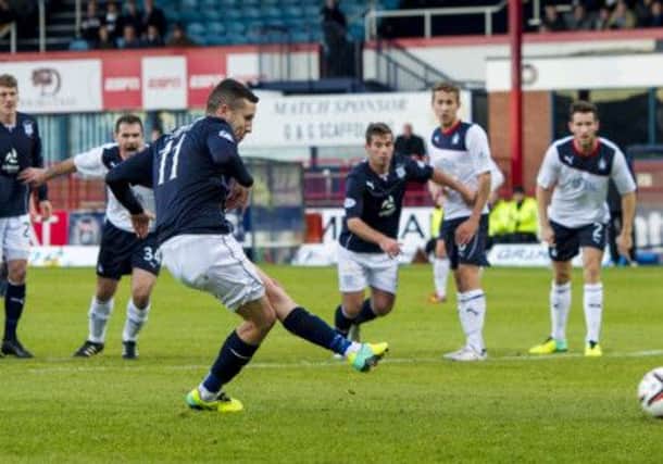 Dundee's Ryan Conroy coolly slots home his penalty to make it 1-0 to the home side at Dens Park. Picture: SNS