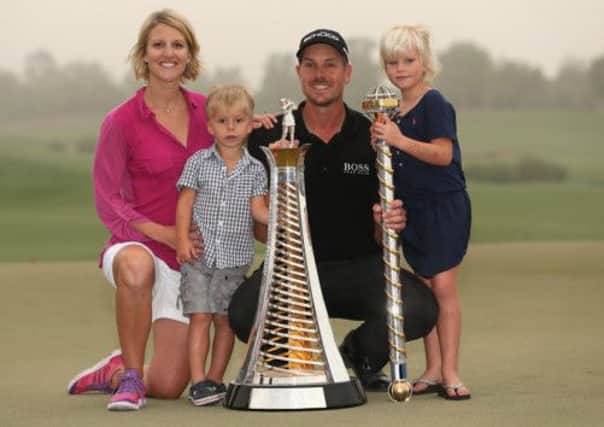 Henrik Stenson's celebration after clinching the European Tour's Race to Dubai was a family affair with wife Emma and their children Karl and Lisa. Picture: Getty