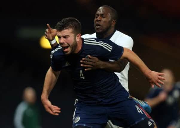 Grant Hanley vies with United States' Jozy Altidore on Friday. Picture: Getty