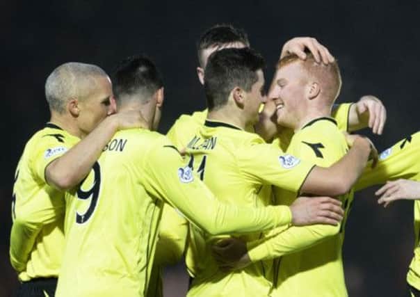 Conor Newton, right, is congratulated by Kenny McLean after doubling St Mirren's lead. Picture: SNS