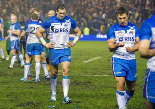 Scotland's Sean Lamont cuts a dejected figure at full-time. Picture: SNS