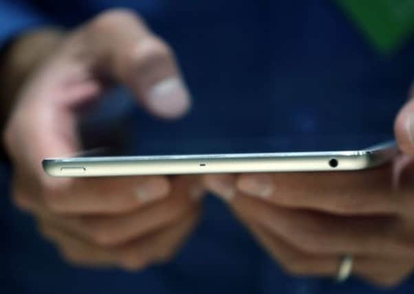 Thefts of tablet devices such as the iPad mini have risen by 10 per cent on public transport. Picture: AP