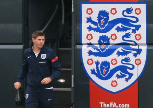 Steven Gerrard, pictured getting off the England bus, is facing Germany for a fourth time tonight. Picture: PA