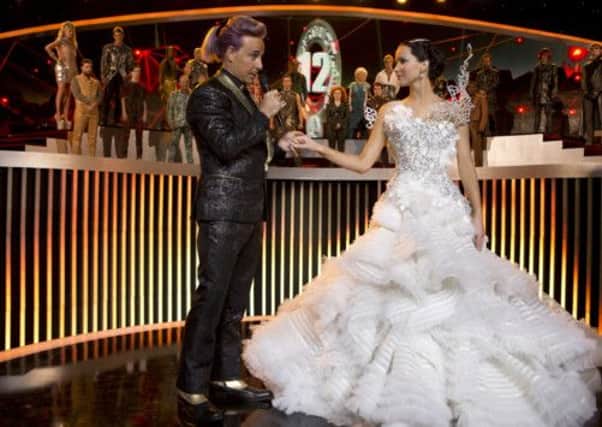 Caesar Flickerman (Stanley Tucci) and Katniss Everdeen (Jennifer Lawrence). Picture: Contributed