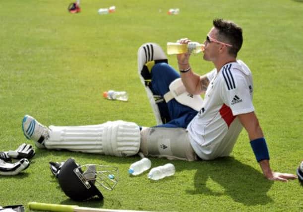 Kevin Pietersen slakes his thirst during a nets session at The Gabba yesterday ahead of the first Ashes Test at the Brisbane venue. Picture: PA