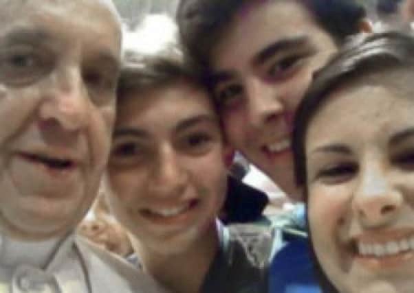 Riccardo Aguiari, second from left, took the 'selfie' photo alongside Pope Francis. Picture: AP