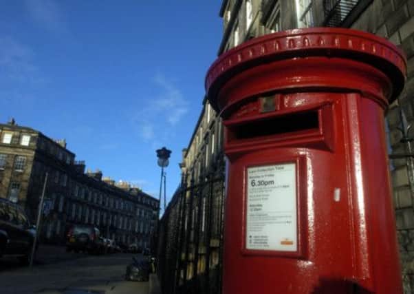 Traditional red post boxes are under threat from cheaper stainless steel alternatives. Picture: TSPL