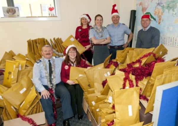 The team pack parcels for personnel in Afghanistan. Picture: MoD