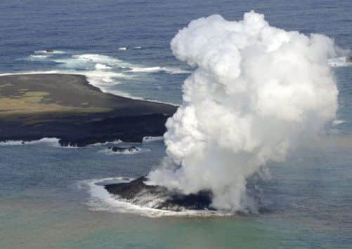 A new island has been formed off the coast of Nishinoshima. Picture: AP/Kyodo Times