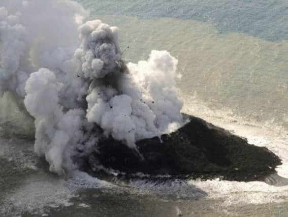 A new island has been formed off the coast of Nishinoshima. Picture: AP/Kyodo Times