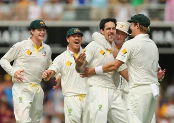 Mitchell Johnson of Australia celebrates after dismissing Joe Root of England. Picture: Getty