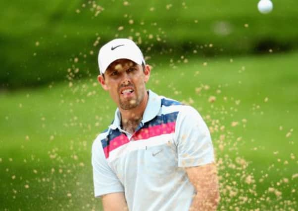 Former Masters champion Charl Schwartzel splashes out of a bunker en route to a 65. Picture: Getty