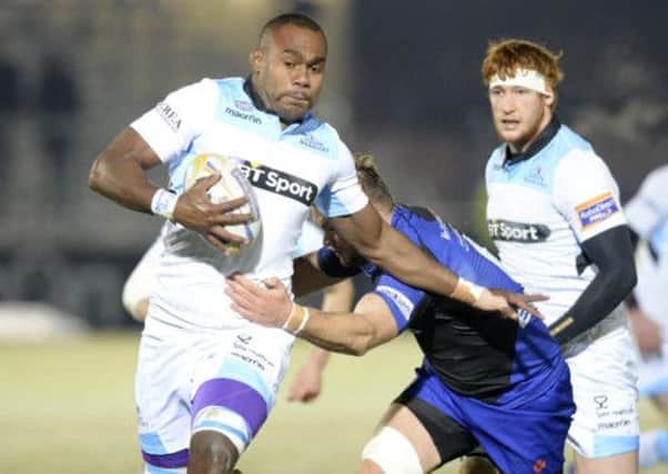 Glasgow Warriors debutant Leone Nakarawa takes on the Dragons defence. Picture: SNS