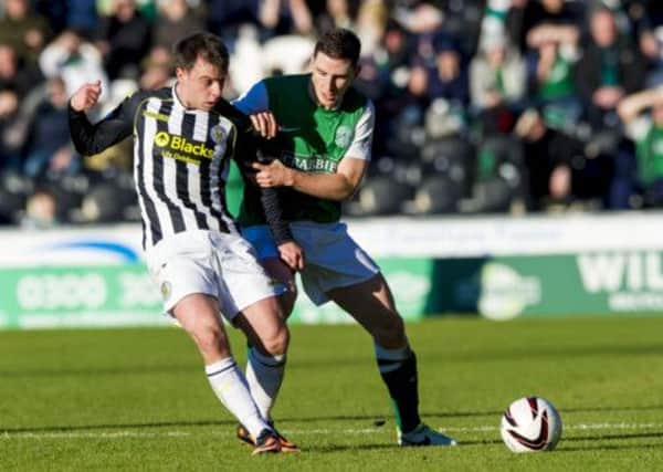 Paul Hanlon, right, puts pressure on St Mirren star Paul McGowan. Picture: SNS