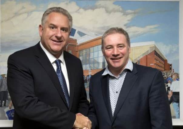 Graham Wallace shakes hands with manager Ally McCoist. Picture: Rangers FC