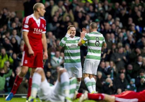 Kris Commons celebrates the first of two goals with team captain Scott Brown. Picture: SNS