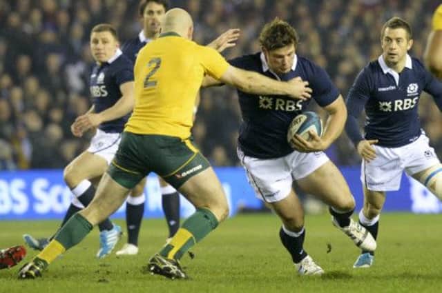 Scotland's Ross Ford (right) is challenged by Stephen Moore. Picture: SNS